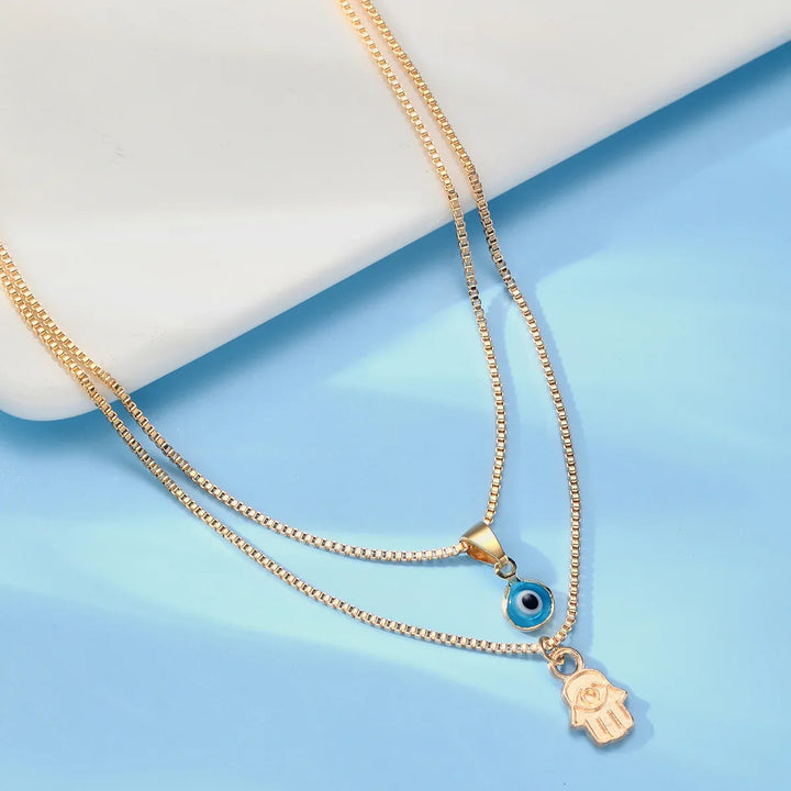 Evil Eye & Hamsa Necklace by weston.®