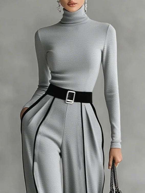 White set with high collar, long sleeves, and wide trousers with belt