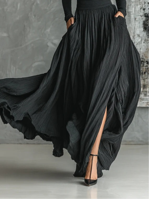 Fashionable set of a black, fitted turtleneck and a pleated skirt