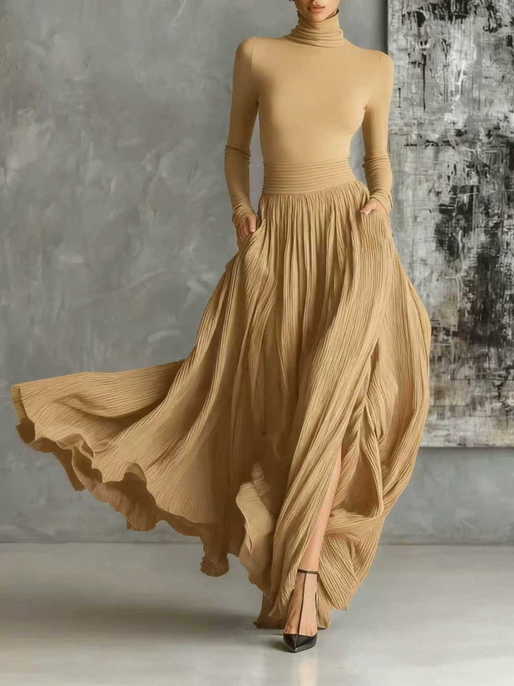 Fashionable set of a black, fitted turtleneck and a pleated skirt
