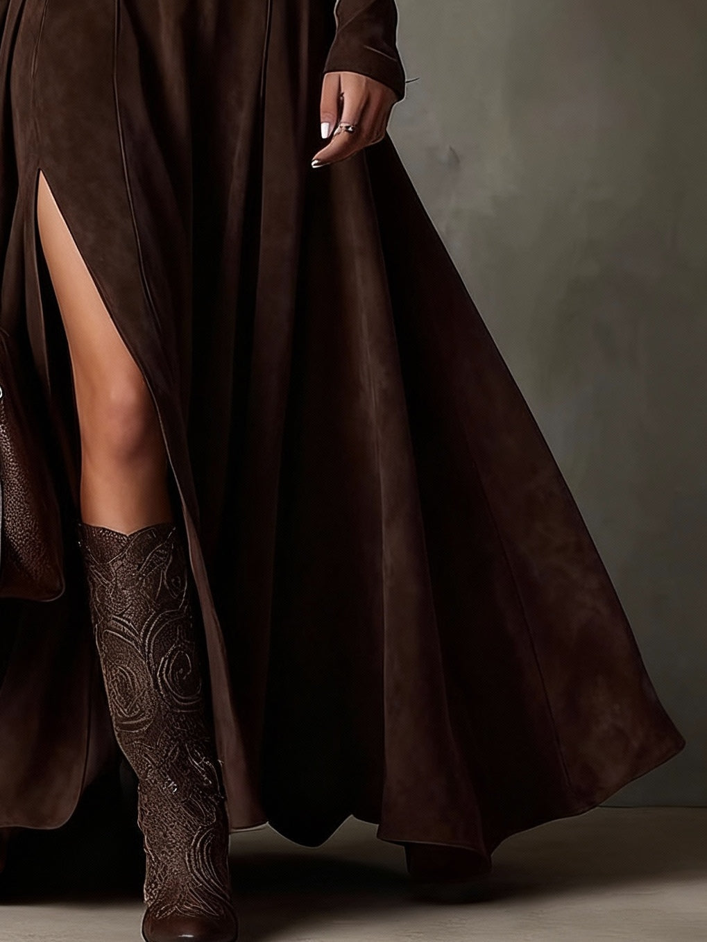 Dark brown maxi dress made of faux suede with a high neck, long sleeves, and a slit (including belt)